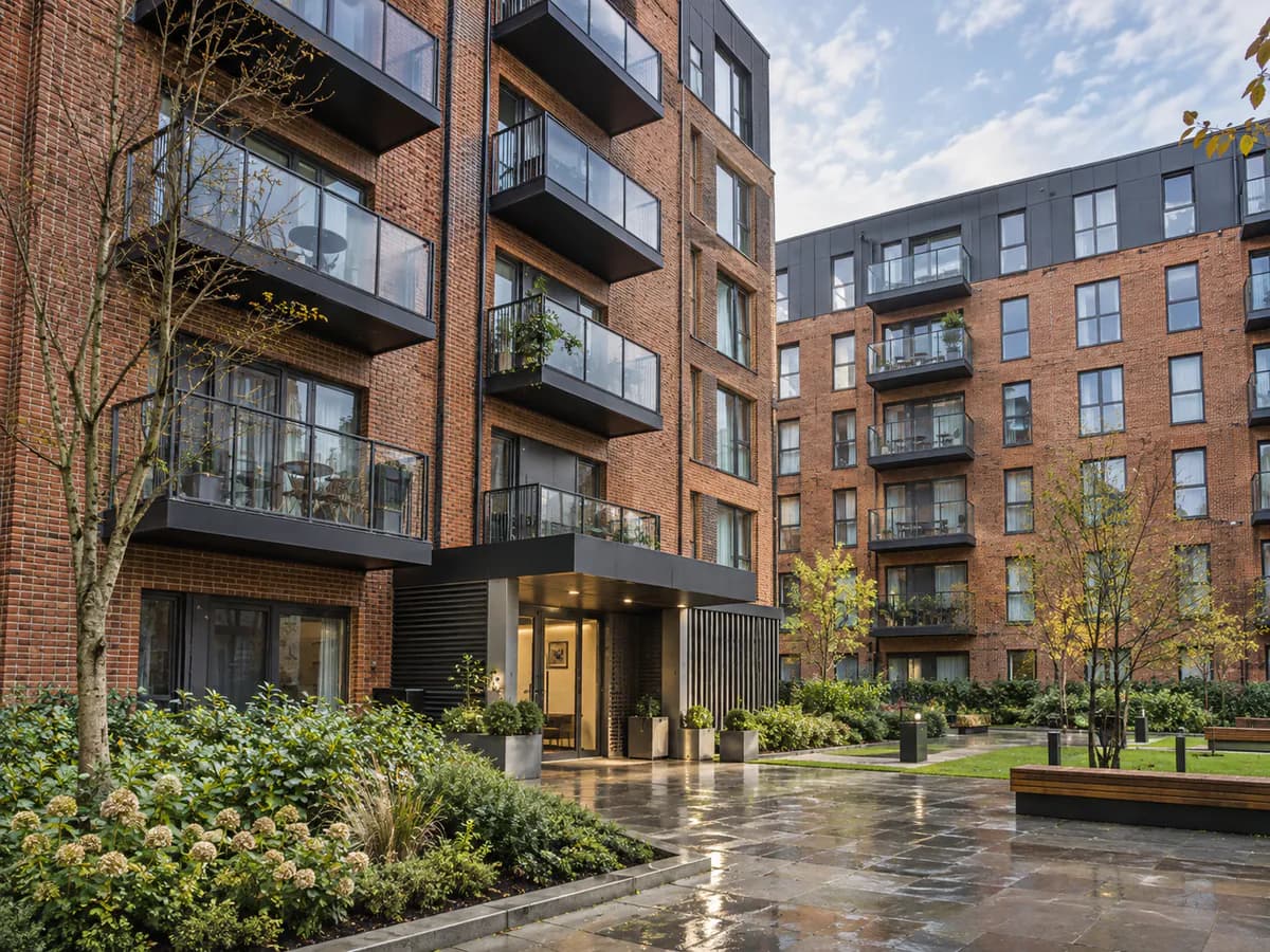 Row of rental apartments with 'To Let' boards
